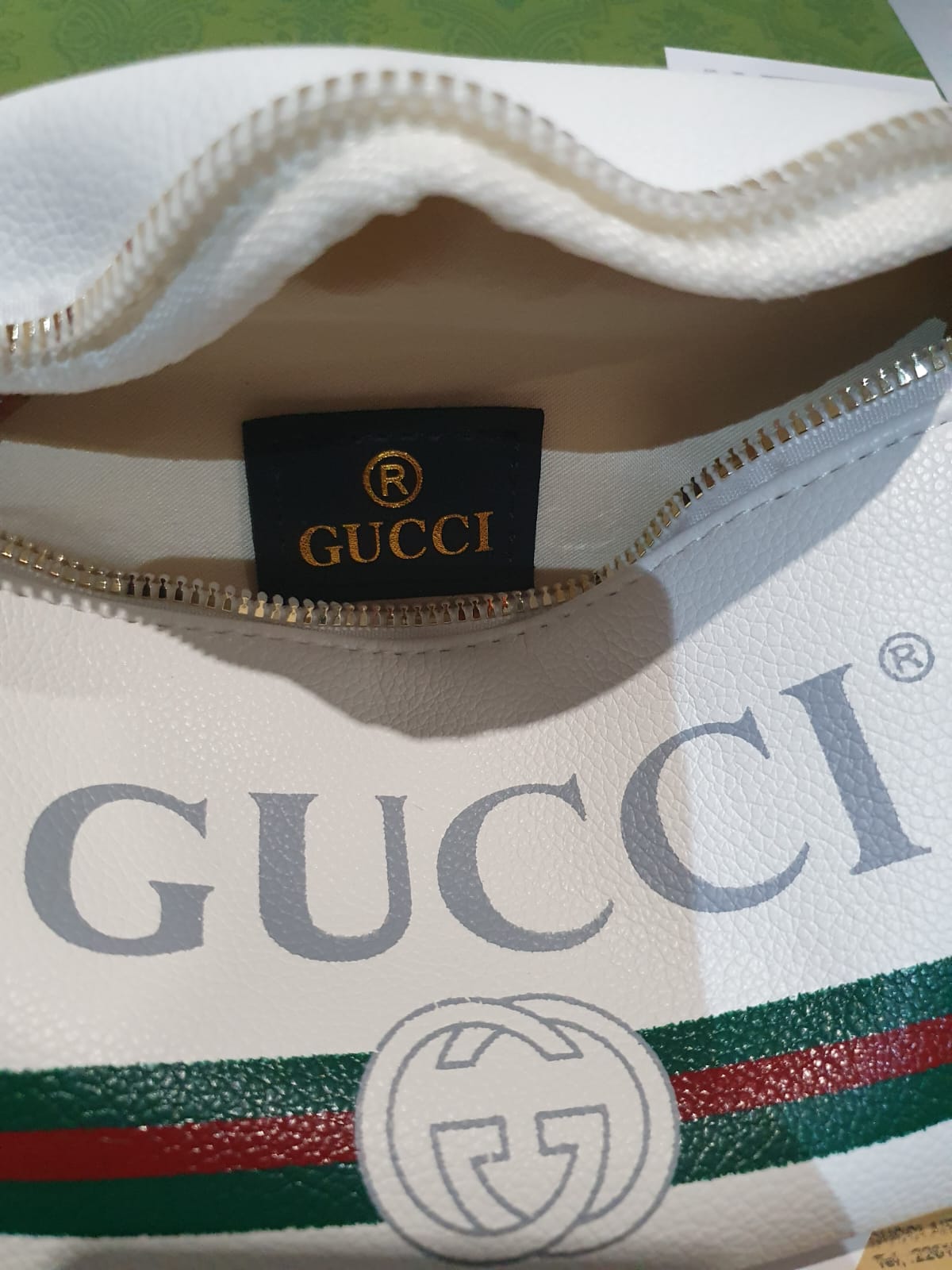 Gucci fanny pack writing sale