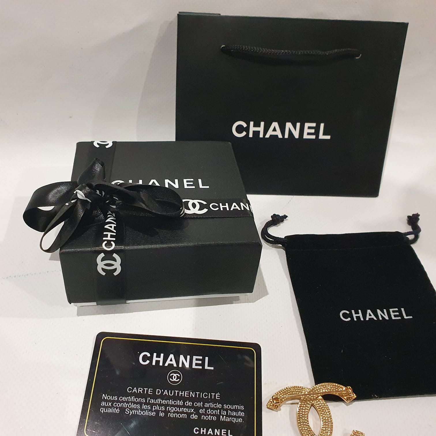 Chanel brooch original price deals