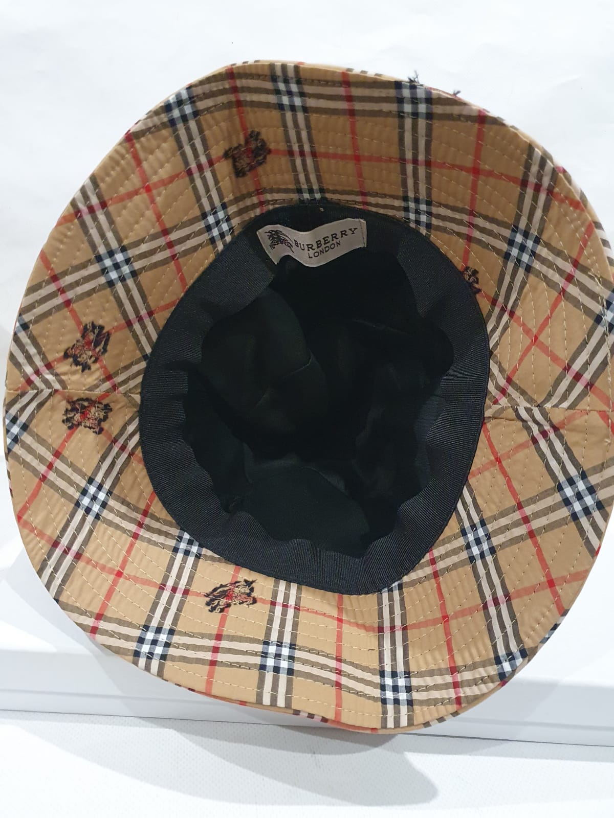 Burberry bucket hat price hotsell